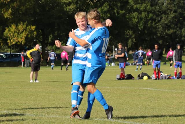 Copnor's Bobby Read is congratulated after scoring the only goal in the Portsmouth & District FA Sunday Intermediate Trophy tie against Saturn Royale. Pic: Kevin Shipp.