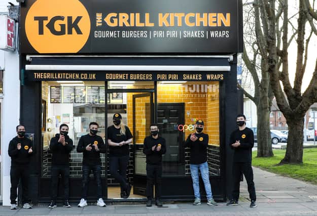 Manager Anhar Uddin, third from right, and staff at The Grill Kitchen, Fratton Rd, Portsmouth
Picture: Chris Moorhouse      (230321-29)