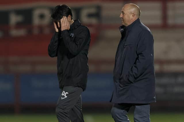 Danny Cowley cut a dejected figure after Tuesday night's final whistle, flanked by Accrington boss John Coleman. Picture: Daniel Chesterton/phcimages.com