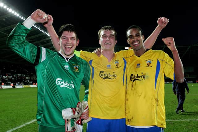 From left - Kevin Scriven, captain Jamie Collins and goalscorer Rocky Baptiste celebrate after Hawks' 1-1 draw at Swansea in the FA Cup third round in January 2008. Picture: Richard Heathcote/Getty Images.