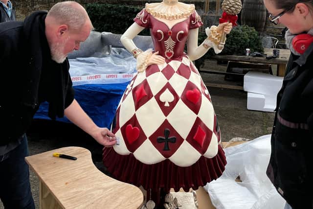 One of the bespoke harlequin figures which will welcome visitors to A Palace House Christmas