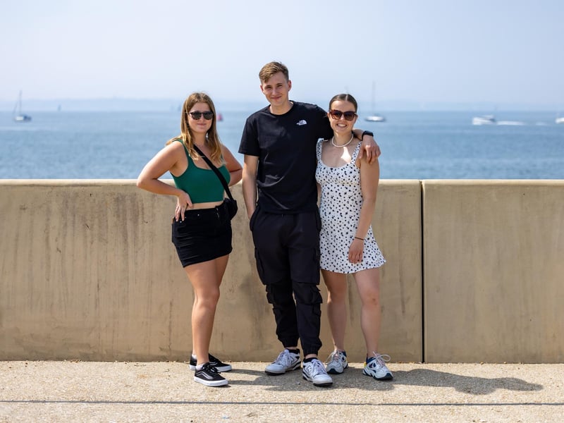 Becka, Jack and Laura from Guildford picked a perfect day for their visit to Southsea. Picture: Mike Cooter (110524)