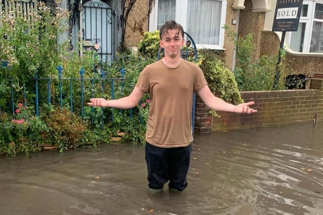 Residents of Salisbury Road in Cosham are calling for urgent action after flooding has hit their street. Jonah Ford stands in the flood. Picture: Lucy Heard