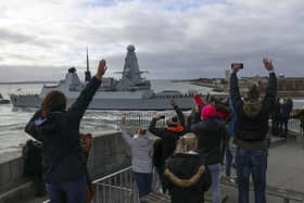 Friends and family watch HMS Dragon from the Round Tower as she returns to Portsmouth Naval Base after a training exercise off the Egyptian coast. Picture: Steve Parsons/PA Wire