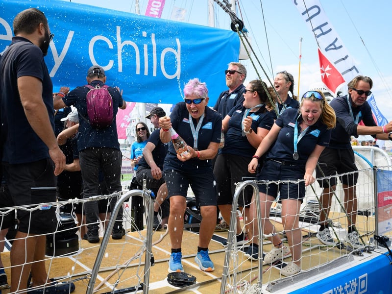 The champagne comes out as the crews moor in Gunwharf. Picture: Keith Woodland (270721-57)