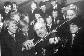 Portsmouth Lord Mayor Fred Warner was on the fiddle, but it was more of a screech if the contorted faces of these pupils was anything to go by. But it was all in good taste as Cllr Warner sportingly joined in a music lesson on a tour of St John’s College, Southsea