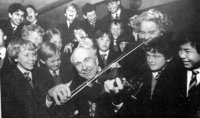 Portsmouth Lord Mayor Fred Warner was on the fiddle, but it was more of a screech if the contorted faces of these pupils was anything to go by. But it was all in good taste as Cllr Warner sportingly joined in a music lesson on a tour of St John’s College, Southsea