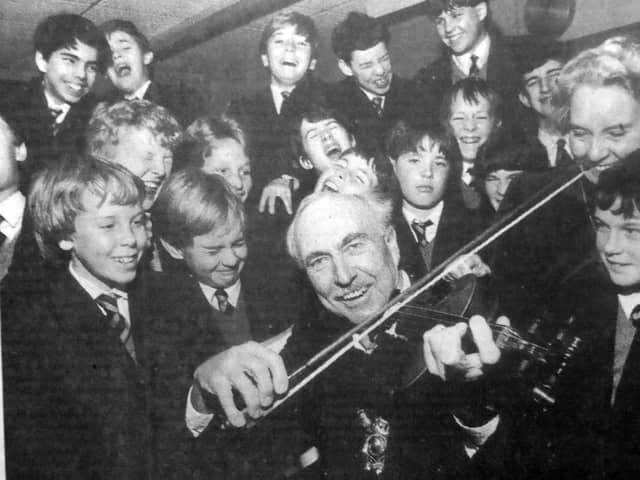 Portsmouth Lord Mayor Fred Warner was on the fiddle, but it was more of a screech if the contorted faces of these pupils was anything to go by. But it was all in good taste as Cllr Warner sportingly joined in a music lesson on a tour of St John’s College, Southsea
