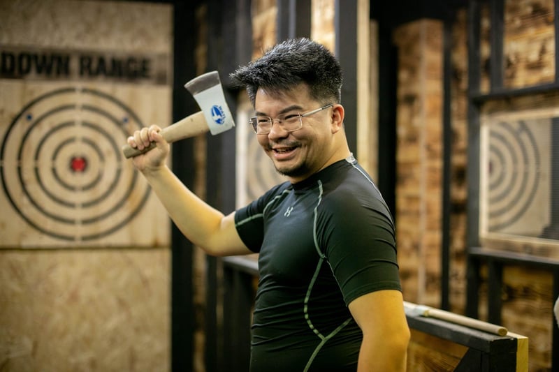 Pictured: Ming Wu having a go at throwing an axe

Picture: Habibur Rahman