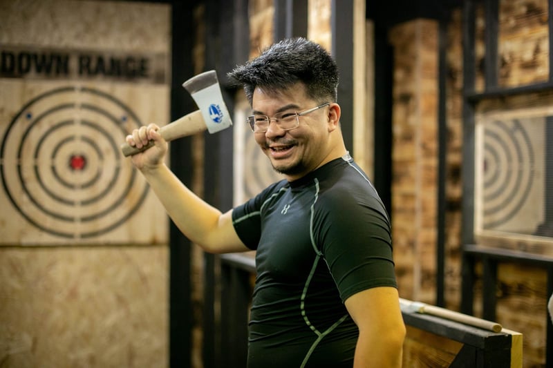 Pictured: Ming Wu having a go at throwing an axe
Picture: Habibur Rahman