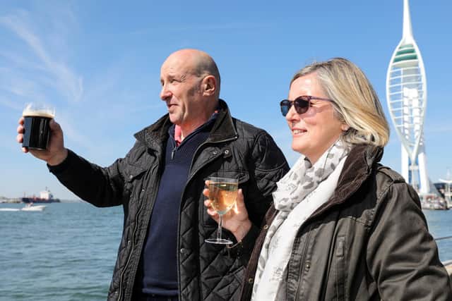 Gary and Shereen Priestley toast the Prince. A minute's silence in Bath Square, Old Portsmouth, for the Duke of Edinburgh at the start of his funeral
Picture: Chris Moorhouse (170421-44)