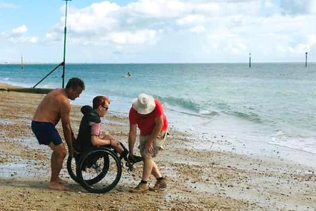 Laura Collinson from Eastney was able to go in the sea at Southsea for the first time in 25 years after the Accessible Beach Campaign For Pompey cleared away some shingle. Picture: Jonathan Schofield