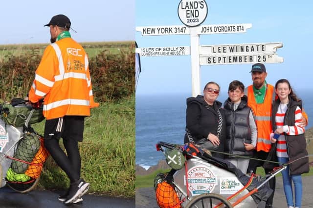 Lee Wingate is met by his family at the iconic Land's End signpost
