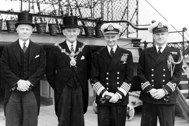 The Lord Mayor of Portsmouth Sir Denis Daly (in top hat) alongside Sir Algernon Willis on the quarter deck of HMS Victory.