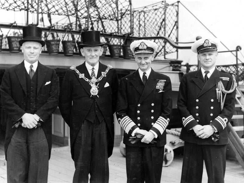 The Lord Mayor of Portsmouth Sir Denis Daly (in top hat) alongside Sir Algernon Willis on the quarter deck of HMS Victory.