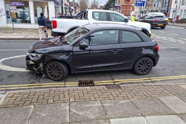 London Road crash scene in Portsmouth that left woman seriously injured