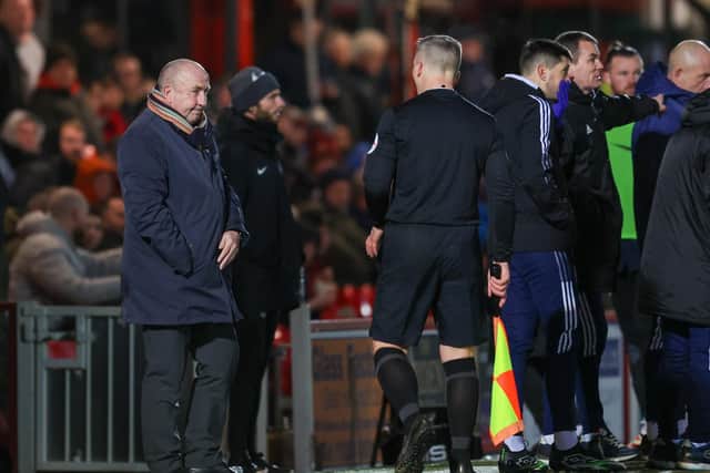 John Coleman after he collided with the assistant referee and was knocked to the floor last night.