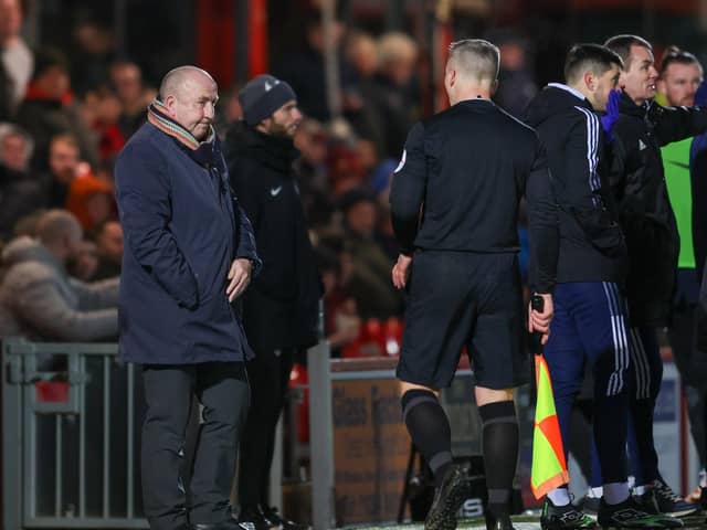 John Coleman after he collided with the assistant referee and was knocked to the floor last night.