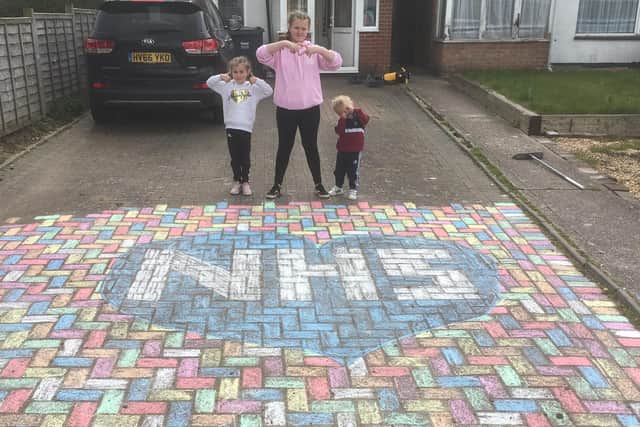 Frankee Hodson, 11, Imogen Cooper, six, and two-year-old Stanley Cooper from Leigh Park created this artwork on their driveway to say thanks to NHS frontline staff
