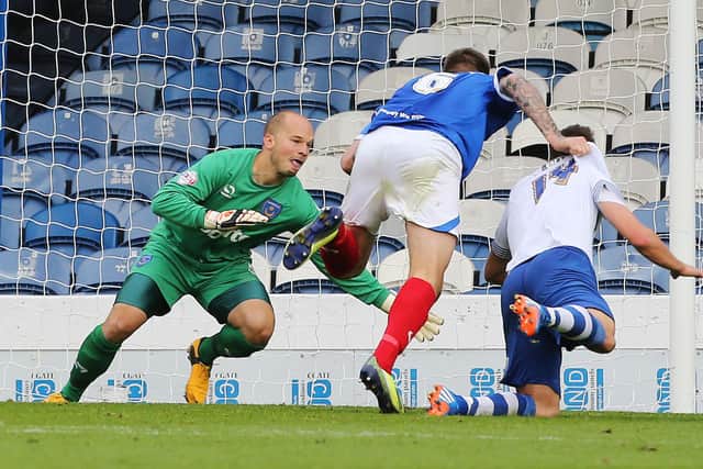 Phil Smith in action during his final Pompey outing - a 1-0 win over Bury in October 2013. Picture: Joe Pepler