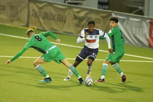 Lucas Sinclair runs between Oxford City pair Reece Fleet and Aaron Drewe. Picture by Dave Haines.