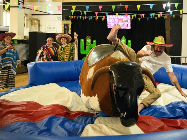 Pictured is: Riding the mechanical bull.
Picture: Keith Woodland