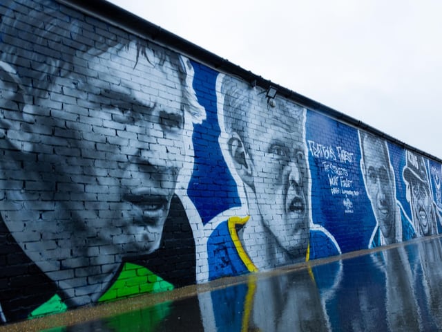Rain couldn't dampen spirits at the unveiling with Alan Knight and Robert Prosinecki also depicted.
