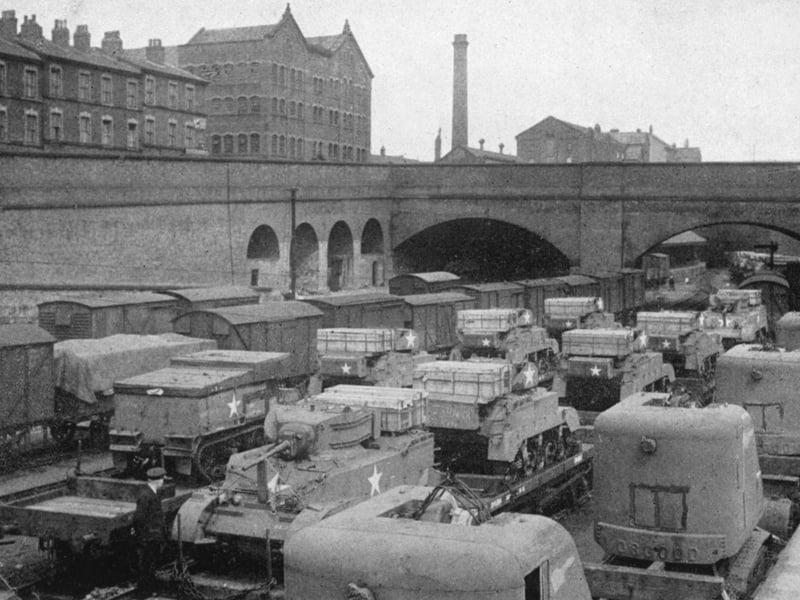 Trains carrying military equipment of all types like this were a common site on British railways as D-Day drew nearer, and more equipment was moved down to the south coast ready for D-Day. Vehicles include Bren carriers and Stuart light tanks. They have the Allied recognition star (doesn't indicate only US troops).