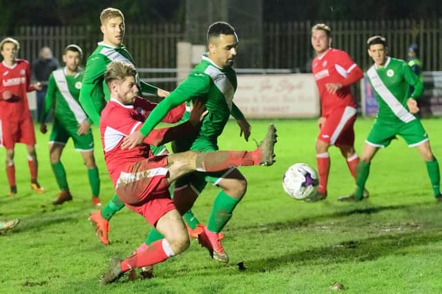 New Fleetlands loan signing Mark Smith (red) in action for Horndean. Picture: Keith Woodland