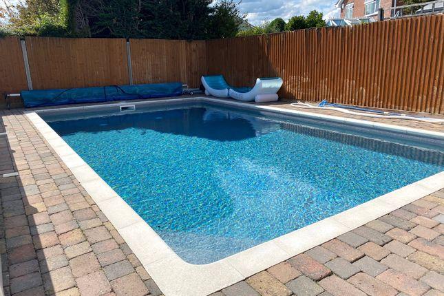 The house comes with a heated outdoor swimming pool.