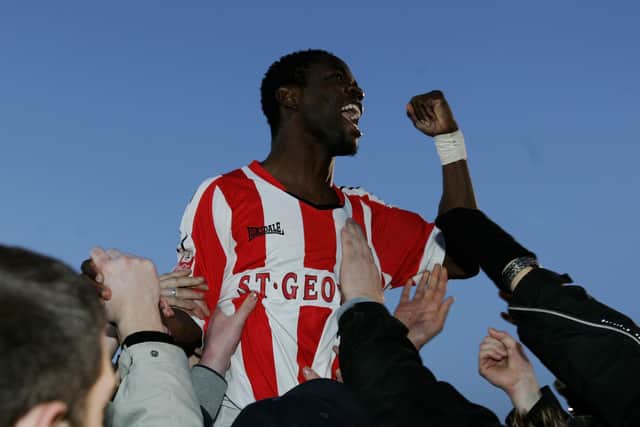 Sam Sodje is carried aloft by Brentford fans after FA Cup victory over Sunderland in January 2006. Picture: Paul Gilham/Getty Images