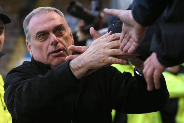 Avram Grant is mobbed at Burnley's Turf Moor