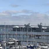 HMS Prince of Wales pictured with the white tents on her flight deck. Photo: Richard Jenkins