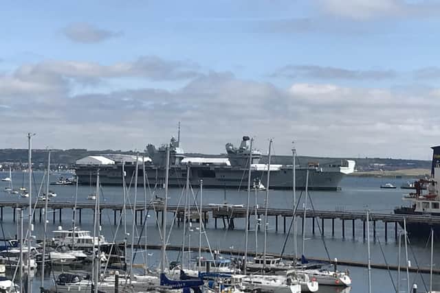 HMS Prince of Wales pictured with the white tents on her flight deck. Photo: Richard Jenkins