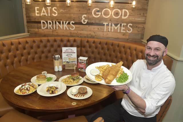 Clarence Pier Brewers Fayre pub has officially reopened on February 6, 2023. 
Pictured: Pete Hookey, kitchen manager with some of the dishes available.