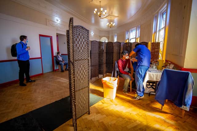 The Jami Mosque, Southsea, is throwing open its doors for its first weekly vaccination session on 30 March 2021
Pictured: Saminoor Choudhury being vacinnated at Jami mosque by Dr Ebadur Chowdhury.
Picture: Habibur Rahman
