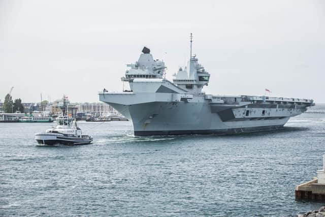 HMS Queen Elizabeth passes the Round Tower, Old Portsmouth  .
Picture: Habibur Rahman