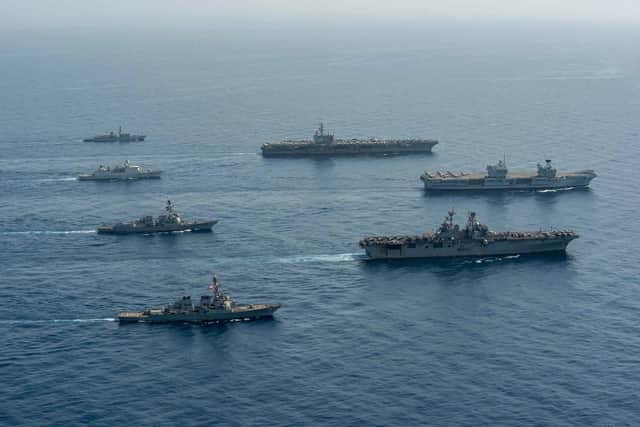 Ships of the UK Carrier Strike Group, USS Ronald Reagan Carrier Strike Group, and Iwo Jima Amphibious Ready Group operate in formation in the Gulf of Aden, July 12. UK, Dutch and U.S. naval forces conducted an integrated at-sea exercise designed to enhance maritime interoperability and demonstrate naval integration through a series of training scenarios. (U.S. Navy photo by Mass Communication Specialist Seaman Gray Gibson)