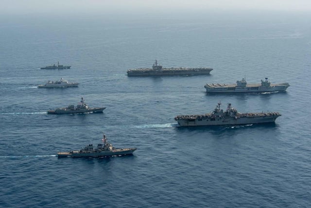 Ships of the UK Carrier Strike Group, USS Ronald Reagan Carrier Strike Group, and Iwo Jima Amphibious Ready Group operate in formation in the Gulf of Aden, July 12. UK, Dutch and U.S. naval forces conducted an integrated at-sea exercise designed to enhance maritime interoperability and demonstrate naval integration through a series of training scenarios. (U.S. Navy photo by Mass Communication Specialist Seaman Gray Gibson)