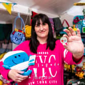 Michelle Martinez, Mr Men Little Miss superfan, holds The Royal Mint's new £5 Little Miss Giggles with Mr Strong coin, which launches today Picture: Ciaran McCrickard/PA Wire