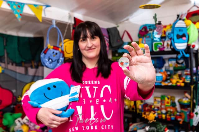 Michelle Martinez, Mr Men Little Miss superfan, holds The Royal Mint's new £5 Little Miss Giggles with Mr Strong coin, which launches today Picture: Ciaran McCrickard/PA Wire
