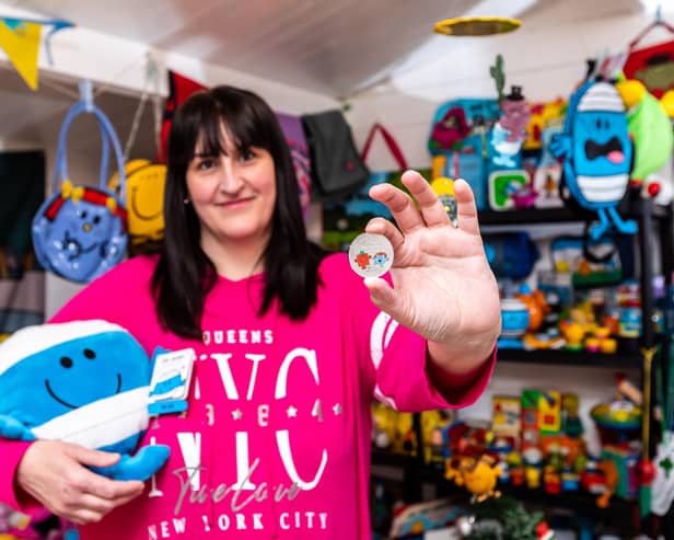 Michelle Martinez, Mr Men Little Miss superfan, holds The Royal Mint's new £5 Little Miss Giggles with Mr Strong coin, which launches today Picture: Ciaran McCrickard/PA Wire