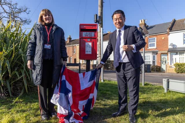Alan Mak MP and Royal Mail Chief Executive Emma Gilthorpe unveil the new post box at Stoke on Hayling Island