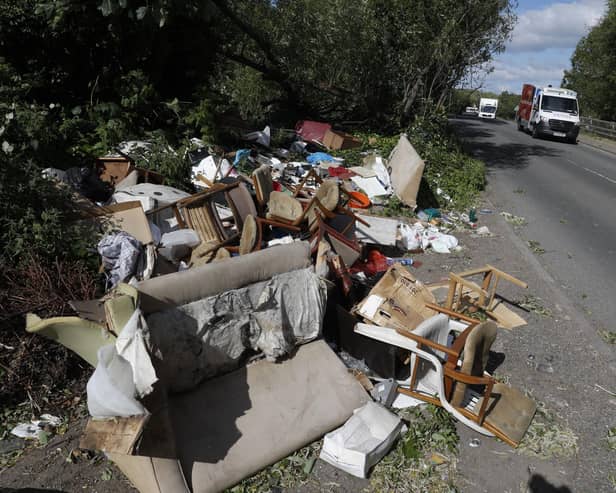 Fly-tipped rubbish and waste is seen beside a road in Colnbrook, near Heathrow, west of London on May 11 2020.