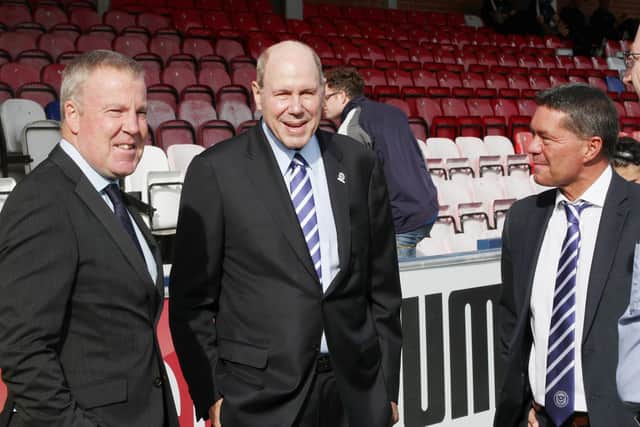 In happier times. Pompey boss Kenny Jackett, with chairman Michael Eisner and Mark Catlin at AFC Wimbledon in October 20198. Picture: Joe Pepler