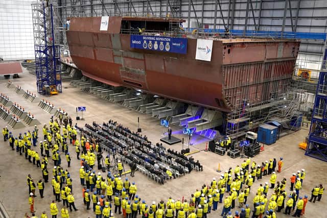 Workers look on at HMS Ventura in the Ventura building which will house HMS Active alongside, as their builds continue after a ceremony for the first cut of steel for the Royal Navy frigate, HMS Active, the Royal Navy's second in class Type 31 frigate, at Babcock International at Rosyth Dockyard on the Firth of Forth at Rosyth, Fife Picture: Andrew Milligan/PA Wire