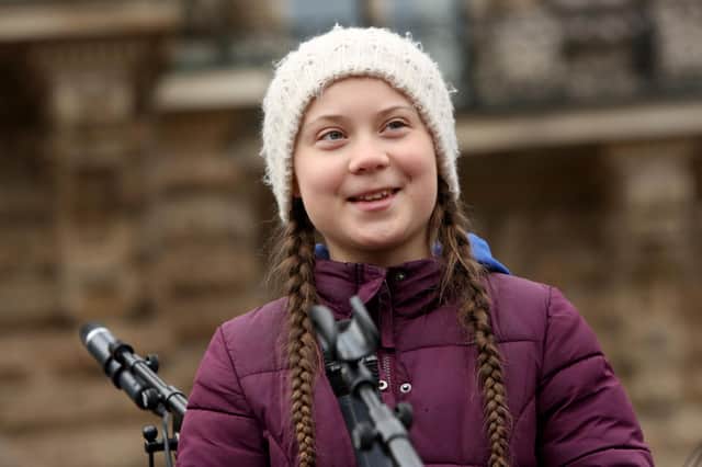 Teenage Swedish activist Greta Thunberg demonstrates with students against global warming at a Fridays for Future demonstration on March 01, 2019 in Hamburg, Germany. Fridays for Future is an international movement of students who, instead of attending their classes, take part in demonstrations demanding for action against climate change. The series of demonstrations began when Thunberg staged such a protest outside the Swedish parliament building. (Photo by Adam Berry/Getty Images)