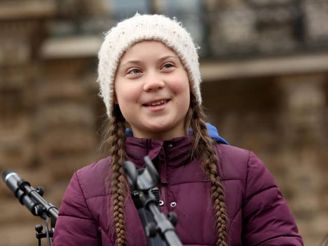 Teenage Swedish activist Greta Thunberg demonstrates with students against global warming at a Fridays for Future demonstration on March 01, 2019 in Hamburg, Germany. Fridays for Future is an international movement of students who, instead of attending their classes, take part in demonstrations demanding for action against climate change. The series of demonstrations began when Thunberg staged such a protest outside the Swedish parliament building. (Photo by Adam Berry/Getty Images)