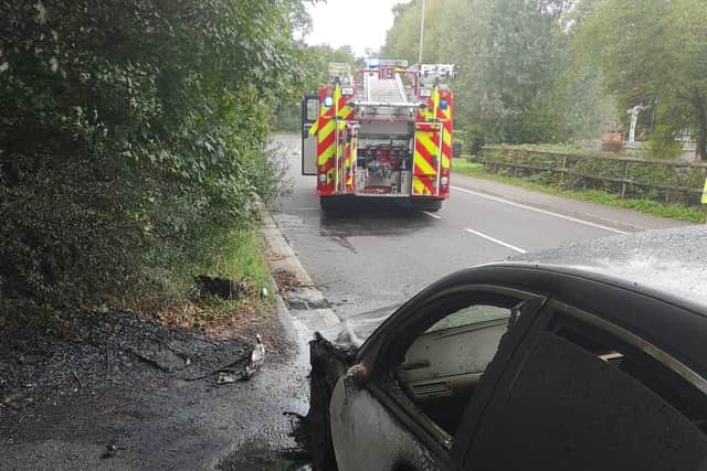 Waterloville fire fighters attending the car fire on Forest Road in Denmead.