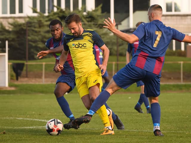 Moneyfields' Dec Seiden (yellow) has joined Portsea Island neighbours Baffins Milton Rovers. Picture: Keith Woodland